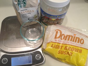 Ingredients for coffee scrub, container, light brown sugar, coconut oil, coffee, scale